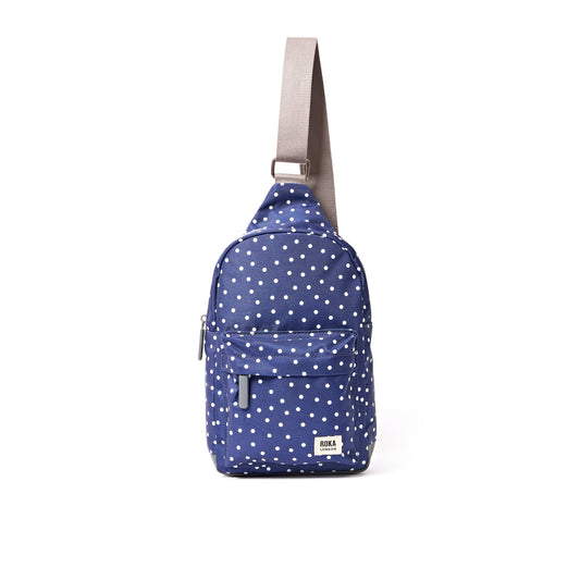 Roka - Willesden Sling Bag in Navy Polka Dot